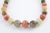 Multicolored agate bead necklace with four aventurine quartz accent beads, brass bead spacers, and clasp. Beads range from...