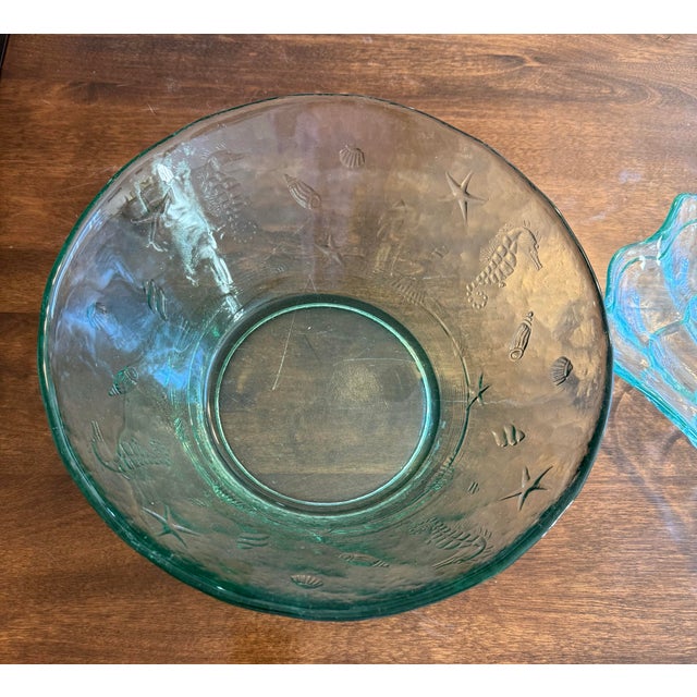 This set includes a blue green, embossed, heavy glass bowl along with a shell design tray. This is a charming vintage set...