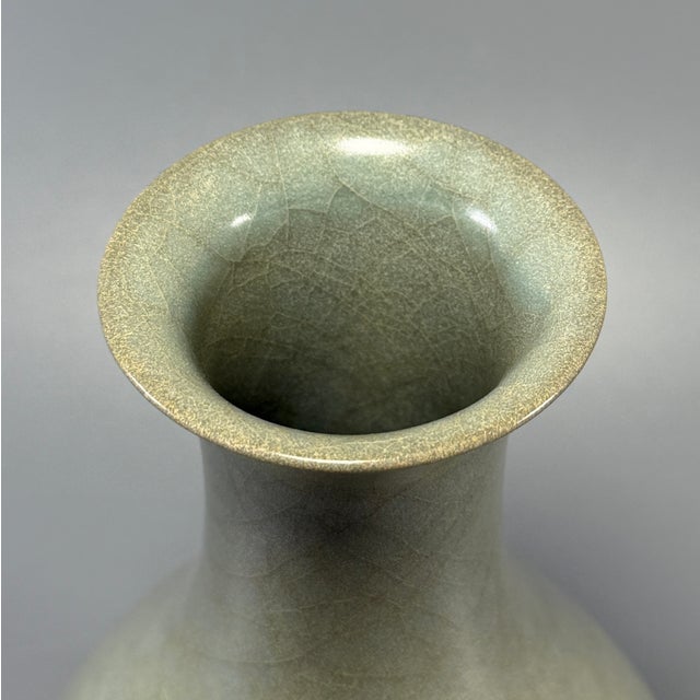 This antique Chinese Yuhuchun vase is a classic traditional form, finished with pale celadon glaze covered in fine natural...