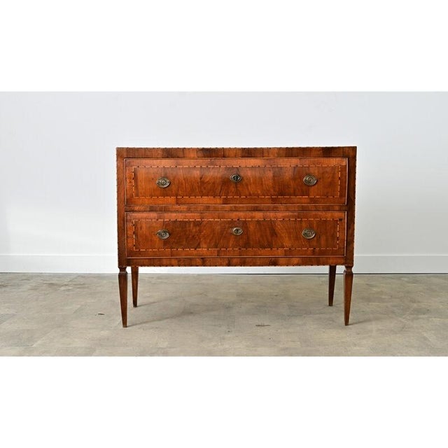 This Italian chest of drawers from the 19th century, in its wide, rectilinear proportions and sturdy construction becomes...