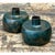 This pair of vintage patinated metal vases takes a compact, sculptural form, each with a wide, drum-shaped body that...