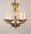 A luxurious midcentury French Louis XV style gilt brass and crystal Maison Jansen chandelier. Maison Jansen is known as...