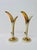 A rare matched pair of 1950s ceramic bud vases attributed to Bauer Pottery. Each features a slender, stylized leaf form...