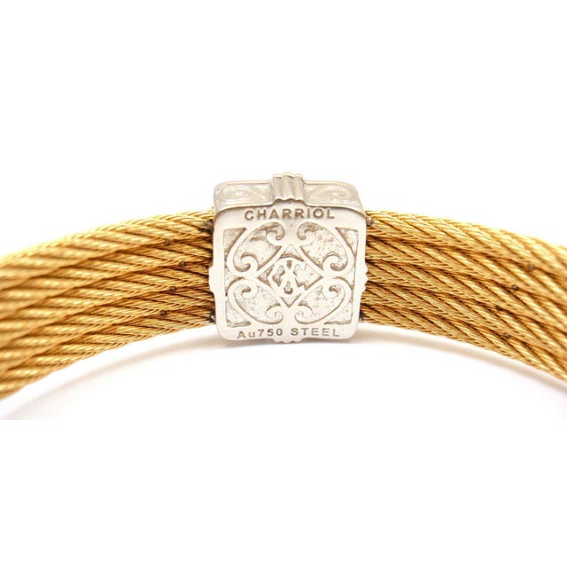 About This Piece: Metal: 18k gold and Seel Ring Size: 7 inches long, open and flexible , approx 12 mm thick Weight 25.4 g...