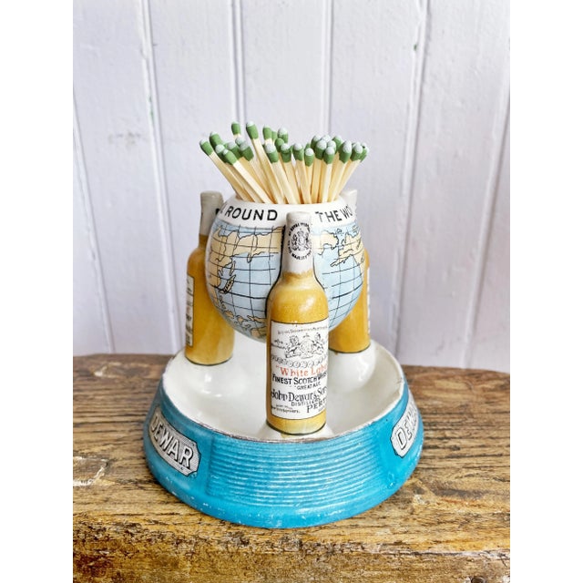 An antique Scottish stoneware match strike, made to be used in a pub to advertise Dewar whisky. In excellent condition for...