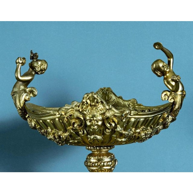 An impressive early 20th-century French gilt bronze tazza, richly conceived in the Rococo Revival taste with elements...