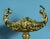 An impressive early 20th-century French gilt bronze tazza, richly conceived in the Rococo Revival taste with elements...