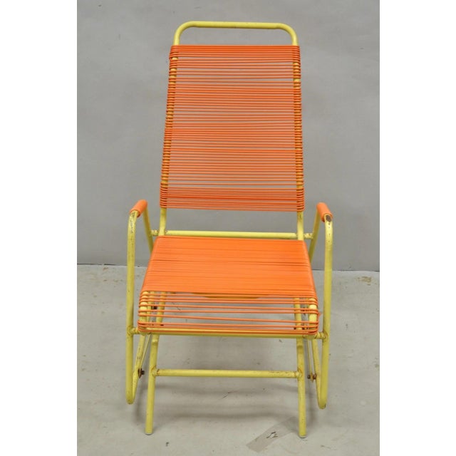Vintage Mid Century Modern Orange Vinyl Spaghetti Strap Metal Tubular Frame Glider Lounge Chair by Maxxin Co, Los Angeles....