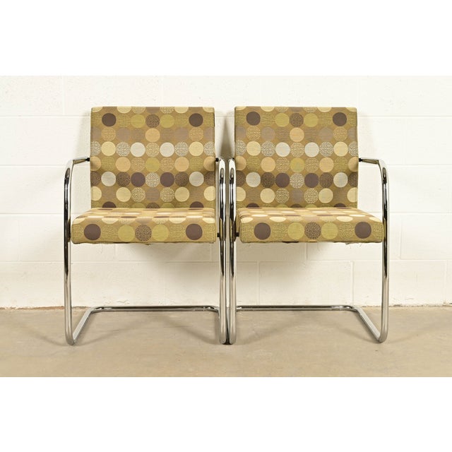 An exceptional pair of Mid-Century Modern "Brno" style tubular cantilever lounge chairs or club chairs In the manner of...