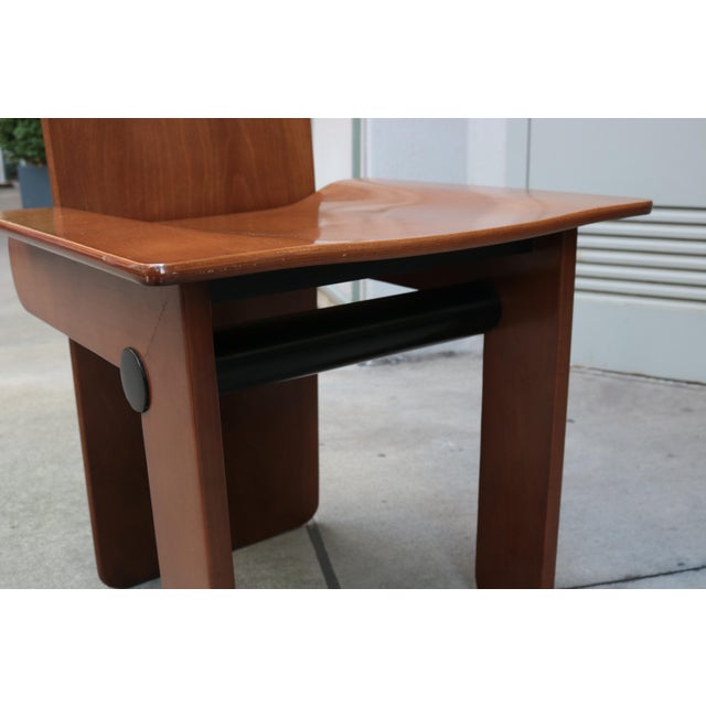 A set of six Modernist dining chairs designed by Carlo Scarpa for Gavina. Stained pine wood with ebonized details.