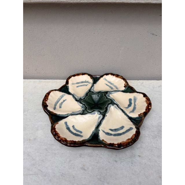 French Majolica oyster plate signed Longchamp, circa 1900.
