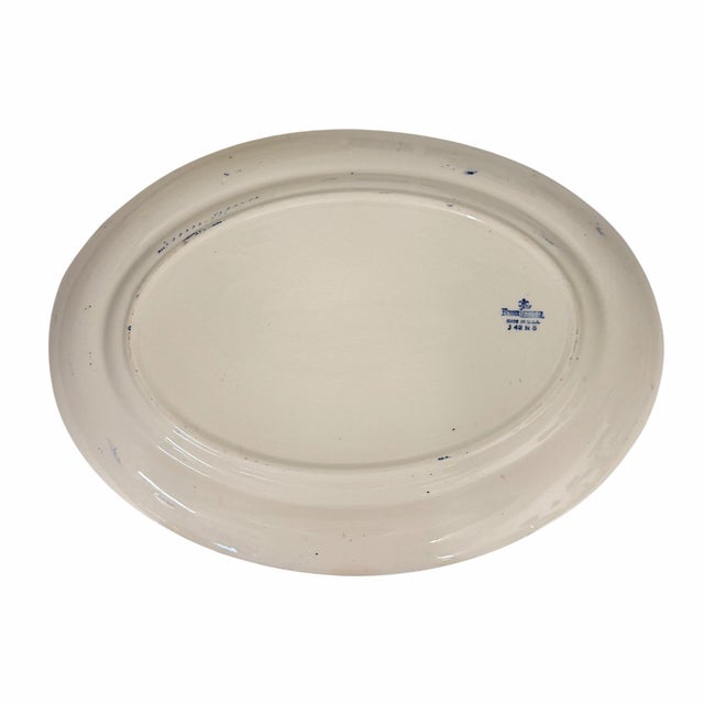 Homer Laughlin blue willow platter. Measures 13.5” w x 10” d x1” h. No cracks, chips or crazing.