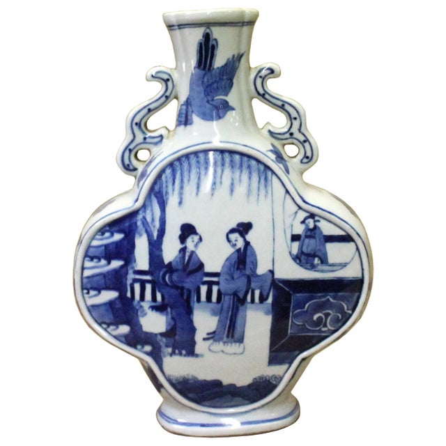 This is a Chinese decorative porcelain vase in Blue and White color finish. The theme is oriental people scenery graphic....