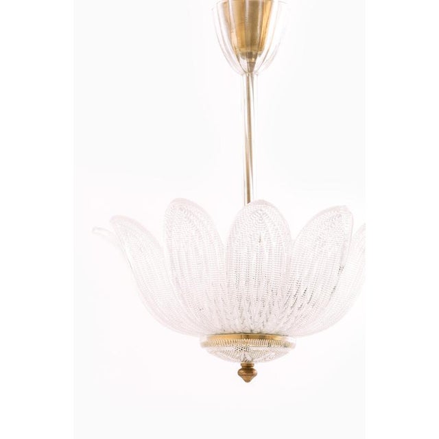 This rare ceiling lamp, designed by carl fagerlund and produced by orrefors in sweden during the 1960s, is a refined...