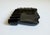 This Art Deco-era ashtray features a stylized male profile and is made of deep black glass with a glossy finish. While...