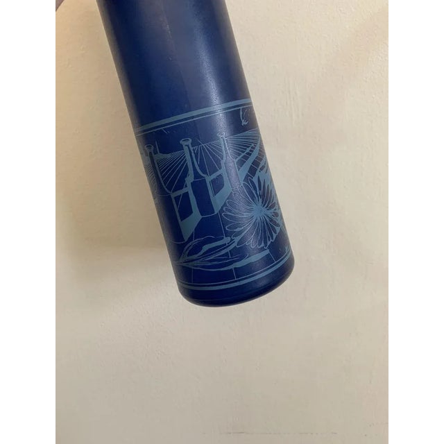 This is a set of 3 blue toned bottles, Rosso Antico bottles that were designed by Salvador Dali. Rosso Antico is a dessert...