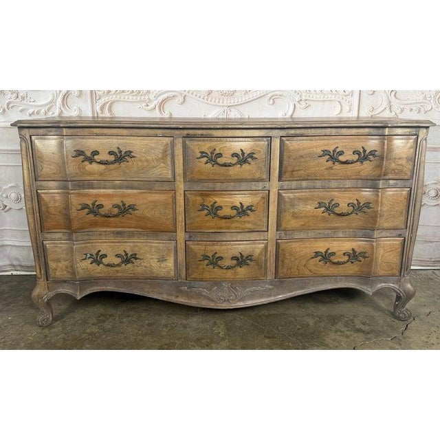 A quintessentially romantic French Louis XV style triple dresser, reimagined with a highly sought-after light bleached...