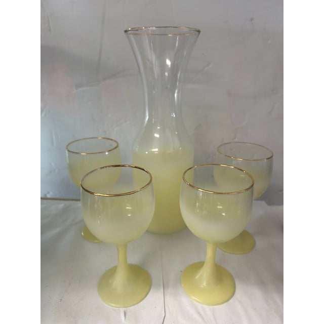 Vintage Blendo carafe with 4 small wine glasses in a pale yellow color. A very cool and hard to find set that will be sure...