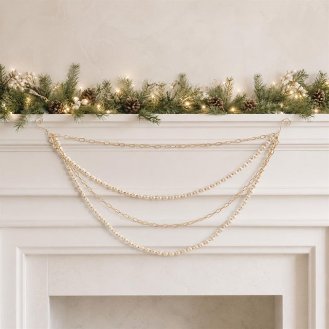 Add a touch of glamour to your holiday decor with this Pearl Bead and Chain Link Garland. Featuring chic gold and ivory...