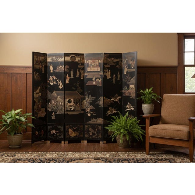 A dramatic statement of Asian artistry to your space with this impressive six-panel black lacquer Coromandel screen....