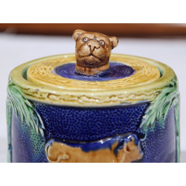 This richly painted Majolica "bonbonniere" was sculpted in France, circa 1880. The round ceramic sugar dish features a lid...