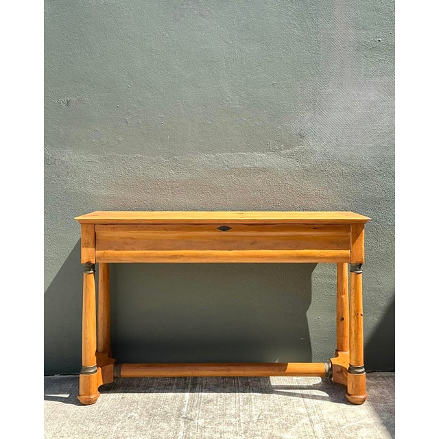 Exemplifying the superior craftsmanship of Baker Furniture’s Milling Road division, this stately console table is a...