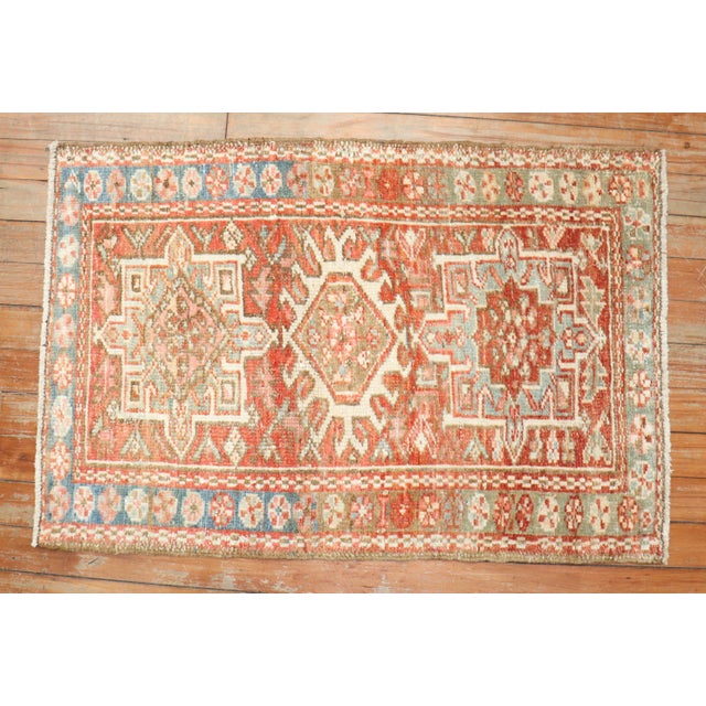 An early 20th century colorful Persian Heriz small rug with your traditional medallion and border motif Measures: 1'11'' x...