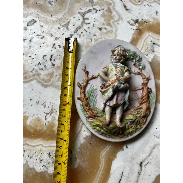 Up for consideration is a beautiful vintage small ceramic english style 3D wall hanging of a boy. This would look lovely...