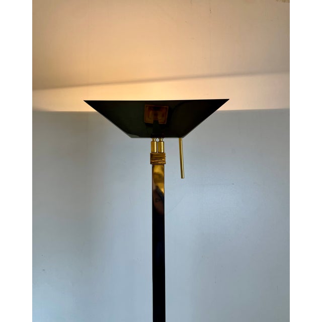 Well-made tall floor lamp in gunmetal and brass, dimmable and adjustable light source. Designed and produced in belgium by...