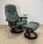 A beautiful, functional, and comfortable vintage dark green leather Stressless recliner and matching ottoman by Ekornes,...