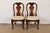A gorgeous pair of Queen Anne or Georgian style side chairs or dining chairs By Baker Furniture USA, Circa 1980s Solid...