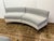 Design Plus Gallery presents a Two Piece Custom Made Curved Sectional. The sectional is of two tones, white with gray,...