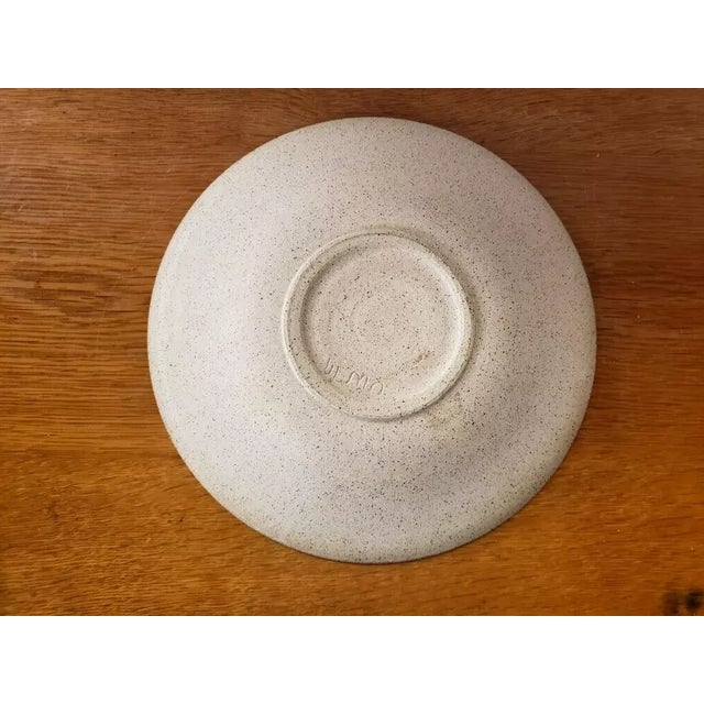 This is a Vintage Clay Bowl with African Mask Motif signed by Casey Wilems. It measures 1 5/8" high and 10 3/4“ in...