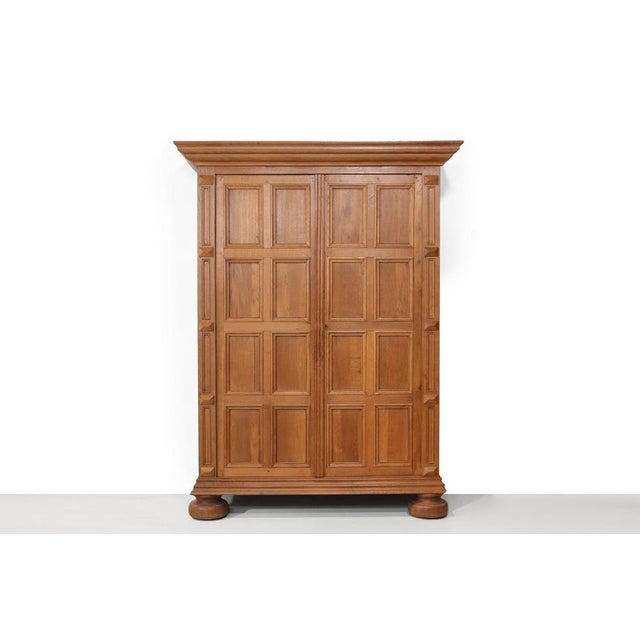 Elegant, monumental solid oak cabinet from the 19th century. Beautifully detailed and exceptionally solid, crafted by a...