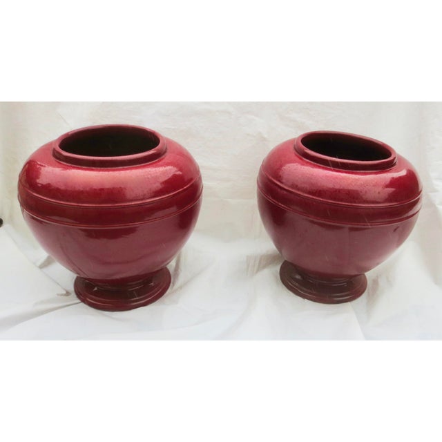 A huge, handsome pair of Robinson Ransbottom Pottery marks is ingrained into the bottom surface. cast in a heavy...