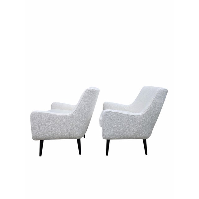 Mid-Century Modern Lounge Chairs Attributed to Charles Ramos, Newly Reupholstered in White Bouclé - Pair An elegant pair...