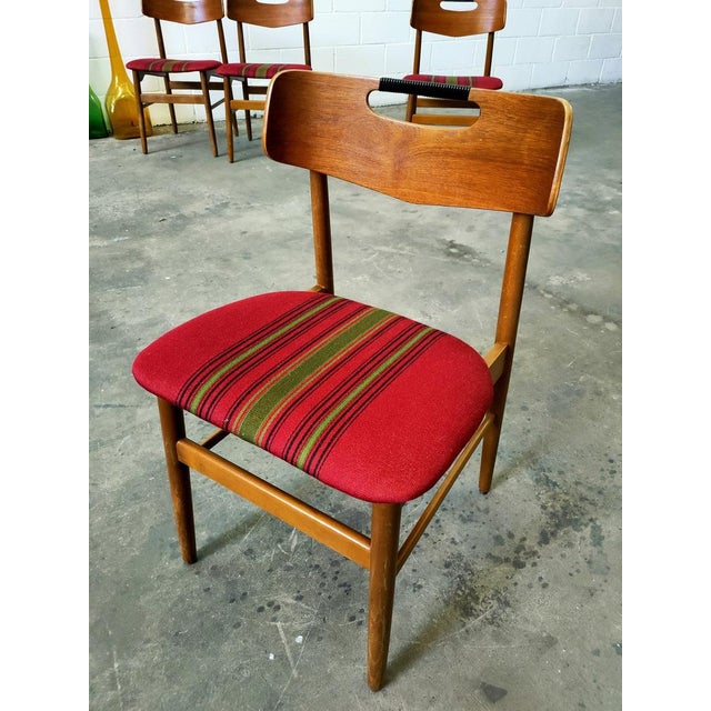 Set of four table chairs manufactured and designed in Denmark in the 60s. Teak structure, seats upholstered in original...