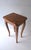 A wood and burl wood end, side, or accent table, in the Rococo style, circa late-20th century. Table is wood with a burl...