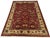 This Bijar Persian design rug has a deep red field filled with flowers, curved vines, and large decorative blooms. Navy,...