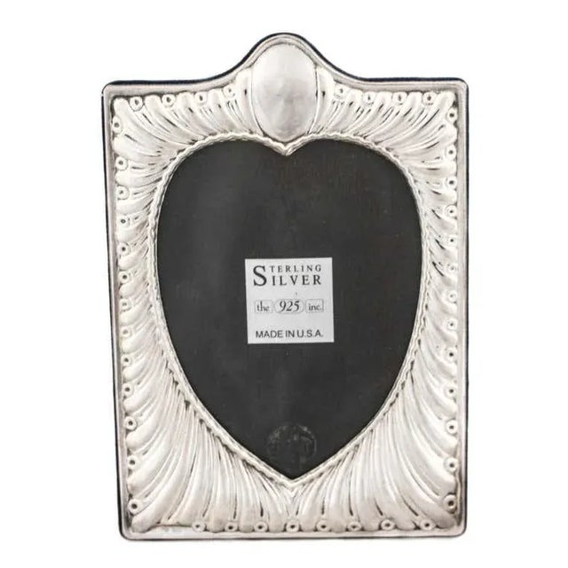Love is in the air and this sterling silver frame will keep it there. What better way to keep someone you love in sight...