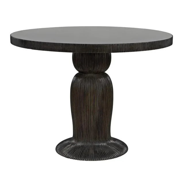 A finely detailed ribbing effect over the body and top edge of this 40" dining table suggests a mushroom, or a cinched...