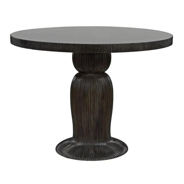 A finely detailed ribbing effect over the body and top edge of this 40" dining table suggests a mushroom, or a cinched...
