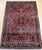 "An exceptional antique Persian Sarouk rug from the first quarter of the 20th century, handwoven with remarkable...