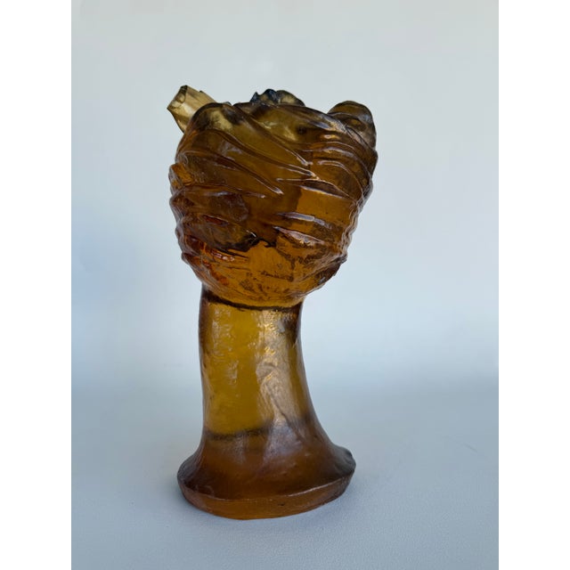 Vintage resin cast of Venus de Milo after the Ancient Greek sculpture. Translucent tones of amber amber modernizes the...