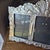 This handcrafted Mexican pewter triple triptych photo picture frame features a folk art style with an ornate design and a...