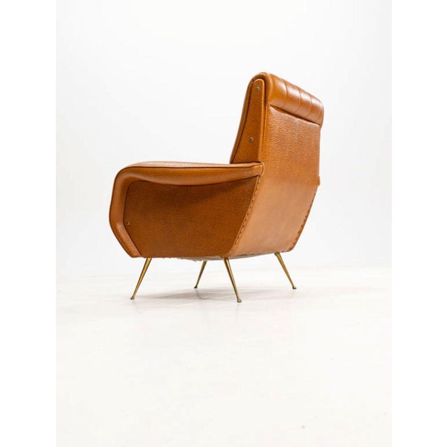 The armchair pictured is in the style of the iconic "lady" armchair, originally designed by italian architect and designer...