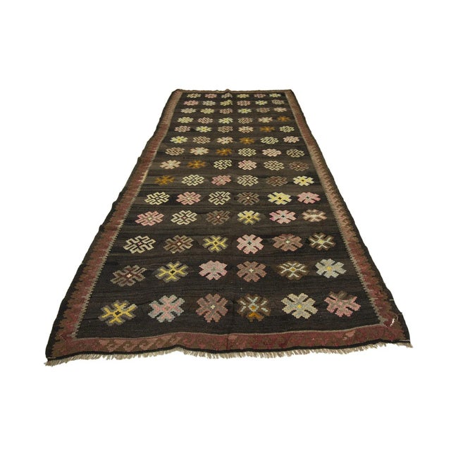 Vintage handwoven decorative kilim rug from Kars region of Turkey. Approximately 50-60 years old. In very good condition.
