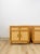 This stunning pair of vintage coastal bamboo parquet nightstands with glass tops are a beautifully crafted and highly...