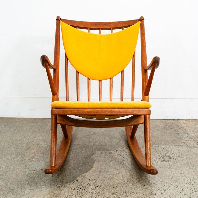 Iconic Danish teak rocking chair in solid teak wood. This chair was designed by Frank Reenskaug for Bramin. Original...