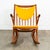 Iconic Danish teak rocking chair in solid teak wood. This chair was designed by Frank Reenskaug for Bramin. Original...